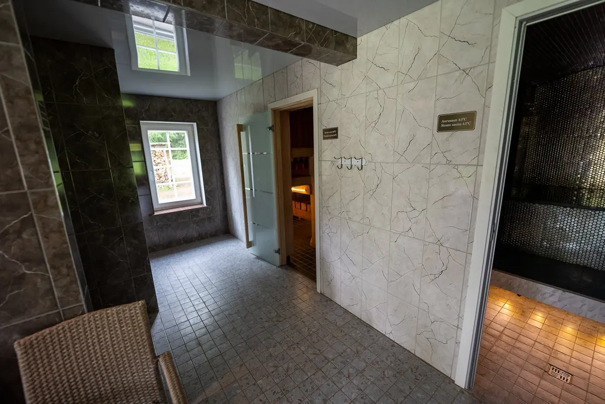 Spa corridor with sauna doors and stone tiles
