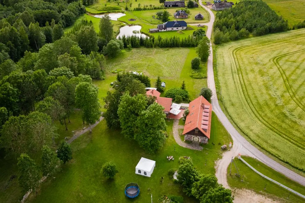 Aerial view of the Õnnela grounds: buildings, park, party tent and ponds
